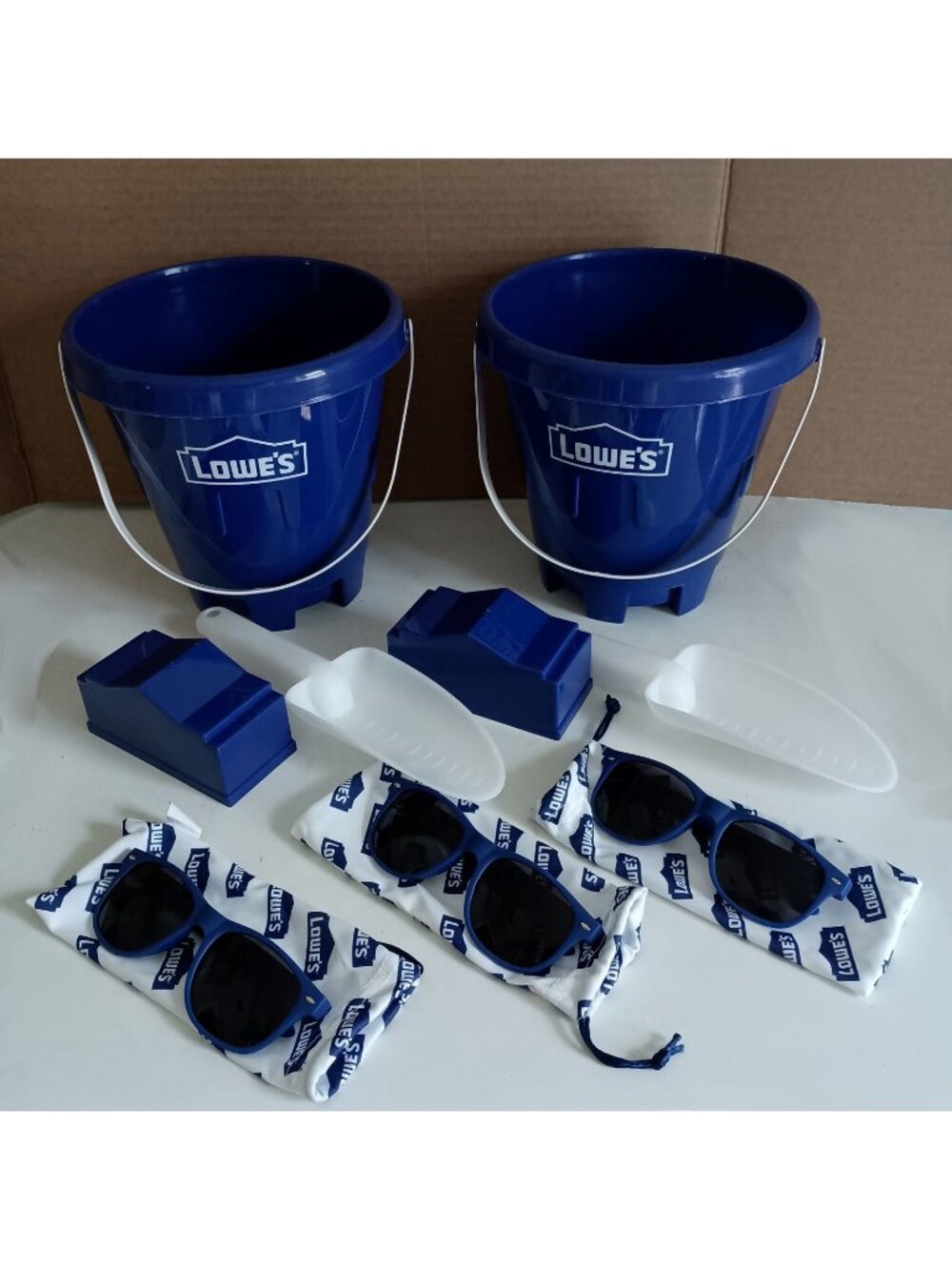 2 Lowes beach bucket sets and 3 pairs Lowes sunglasses with drawstring pouches